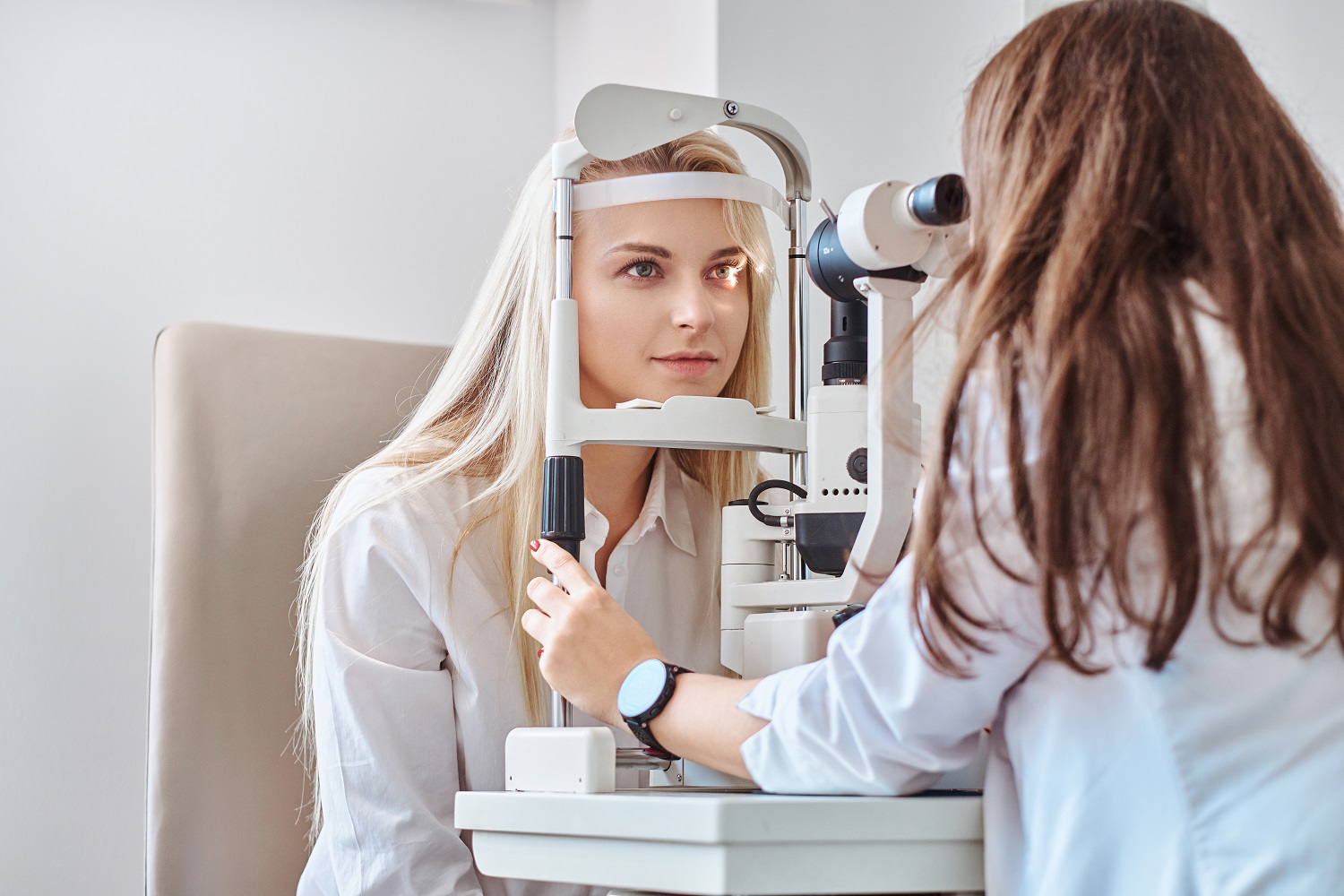 Attractive woman is doing eye test in optical clinic with experienced oculist | Clear Eyes + Aesthetics in Cincinnati, OH